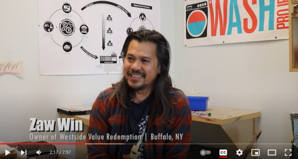 Screen caption of a short documentary film featuring Zaw Win, owner of Westside Value Redemption in Buffalo, NY.